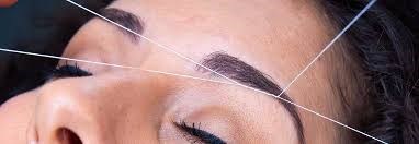 wenkbrauwen epileren met touw.